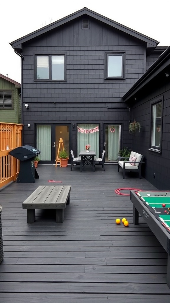 A family-friendly outdoor space featuring a black deck, foosball table, and seating area.