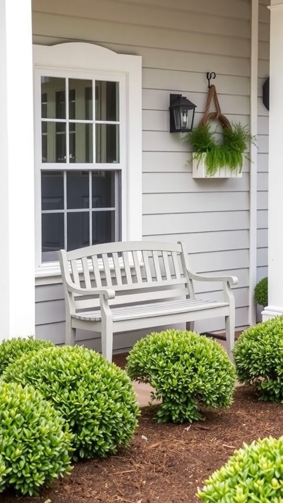 A wooden garden bench surrounded by neatly trimmed boxwood shrubs in a front yard.